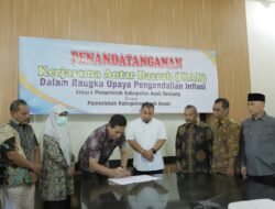 Muslizar Menandatangani Perjanjian Kerjasama Antar Daerah Dengan Pj. Bupati Aceh Besar