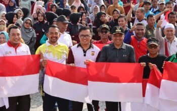 Kapolres Aceh Timur Dampingi Pj. Bupati Launching Gerakan 10 Juta Bendera Merah Putih