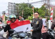Jelang HUT RI ke-80, Kapolres Pidie Bersama Forkopimda Bagikan Bendera Merah Putih